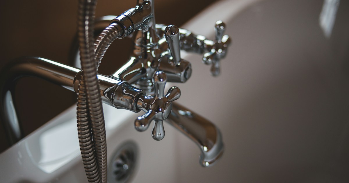Chrome plumbing faucet fixtures in a professional setting